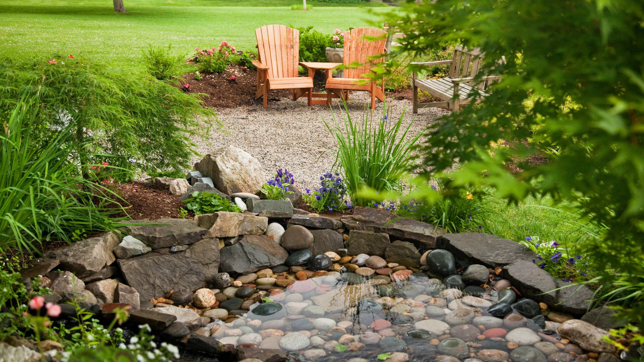 Fish Pond with Waterfall and Bench