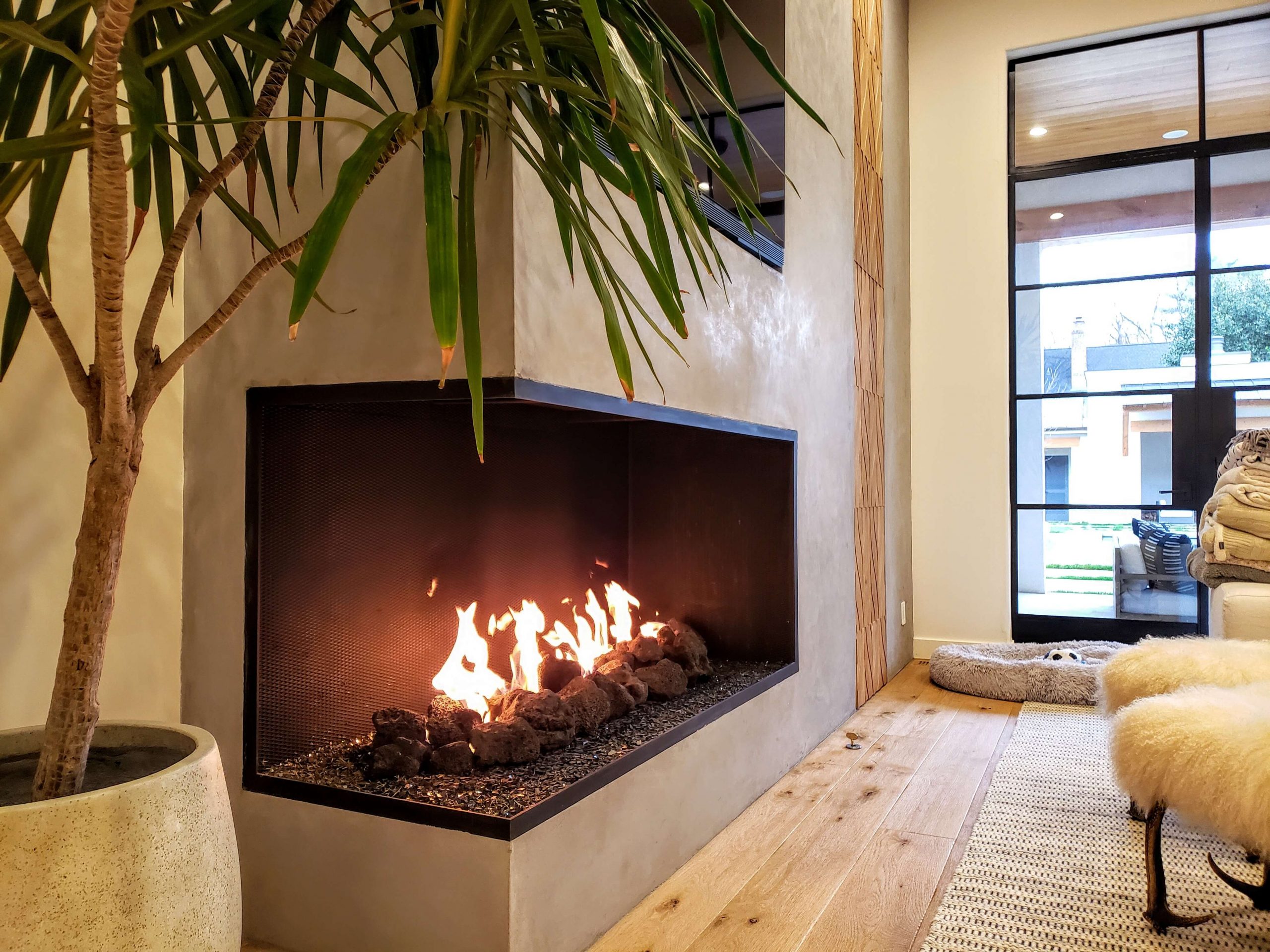 Cozy living room with a gas fireplace and a comfortable couch.