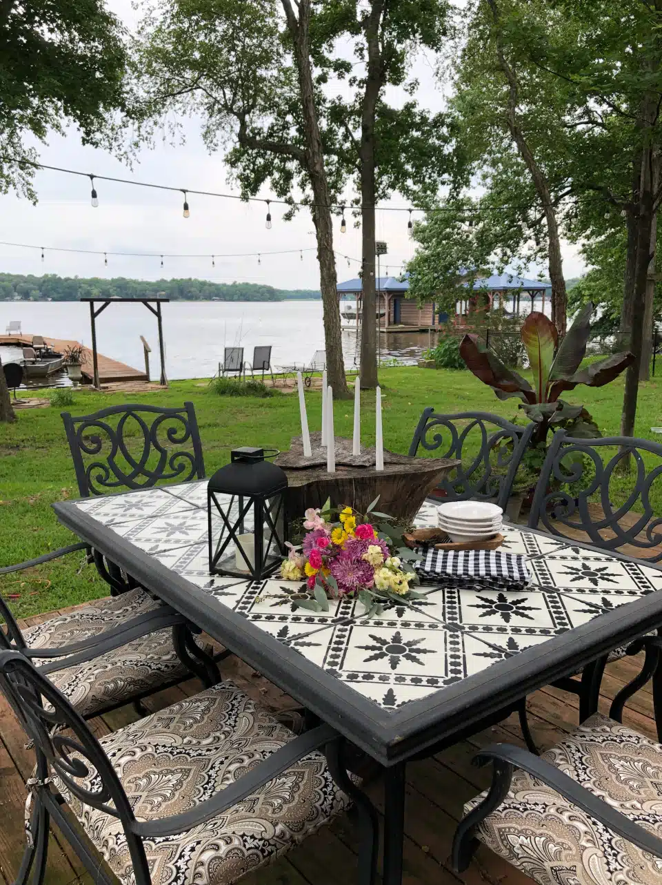 enovated deck with a stylish table set and chairs, transforming the dated tile patio table