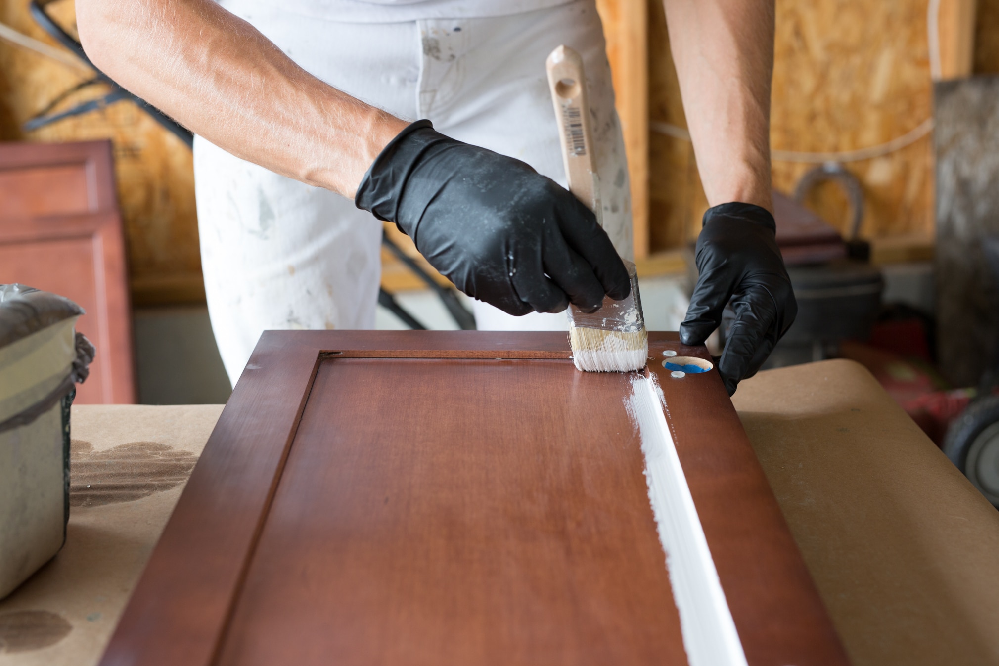 a man working on cabinets