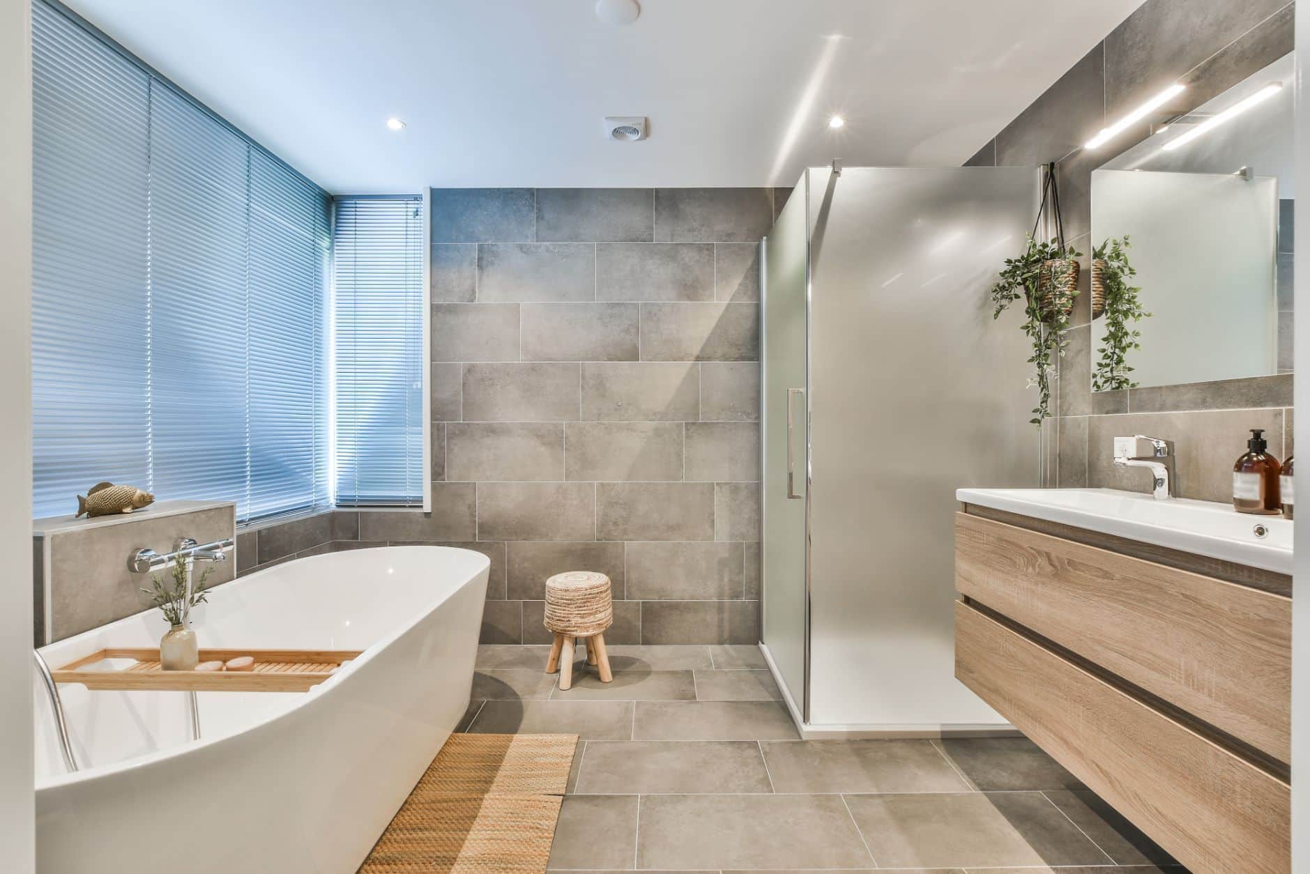 A spacious modern bathroom featuring a large tub and a shower, providing a luxurious bathing experience