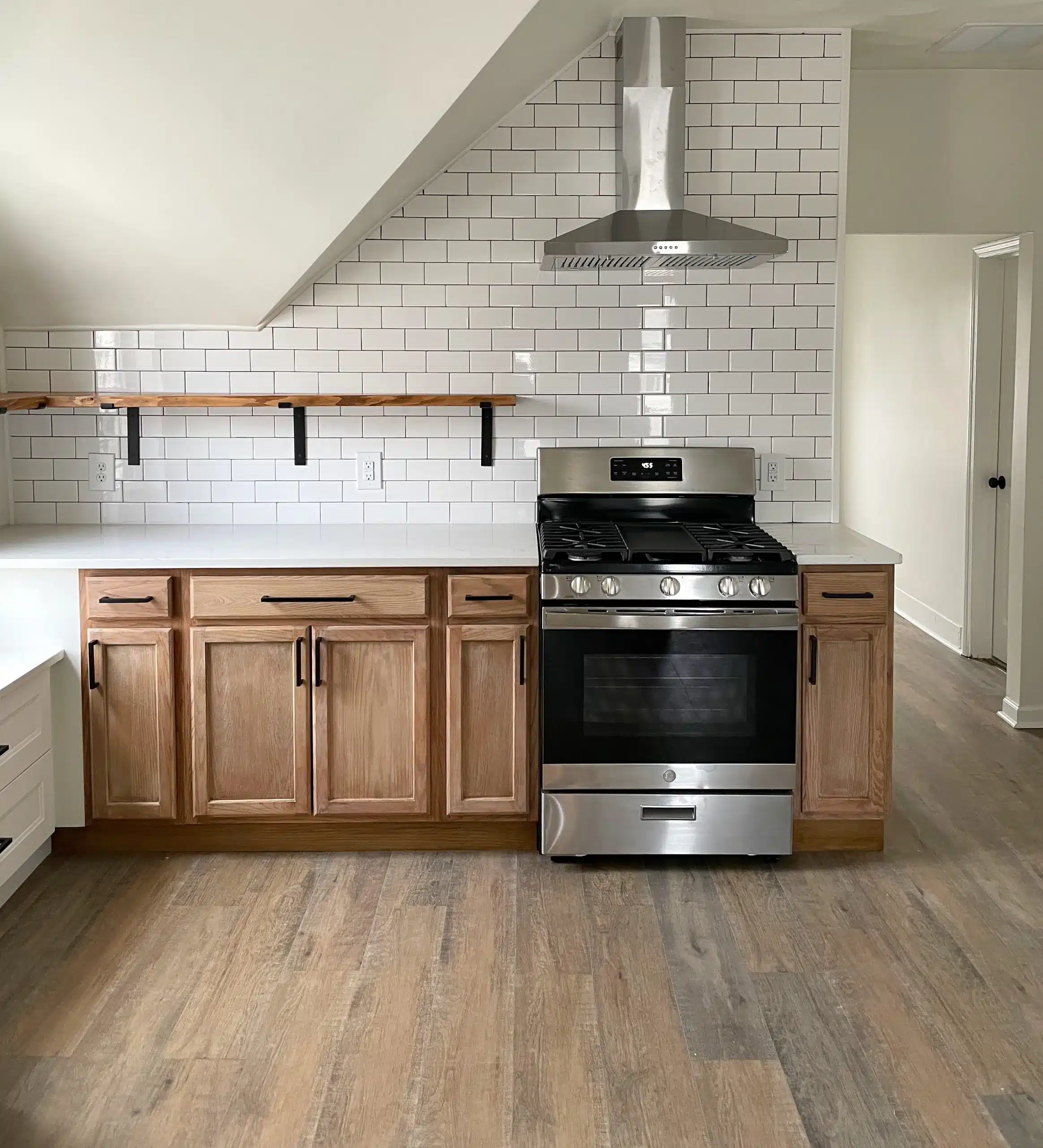 a kitchen with wooden cabinets