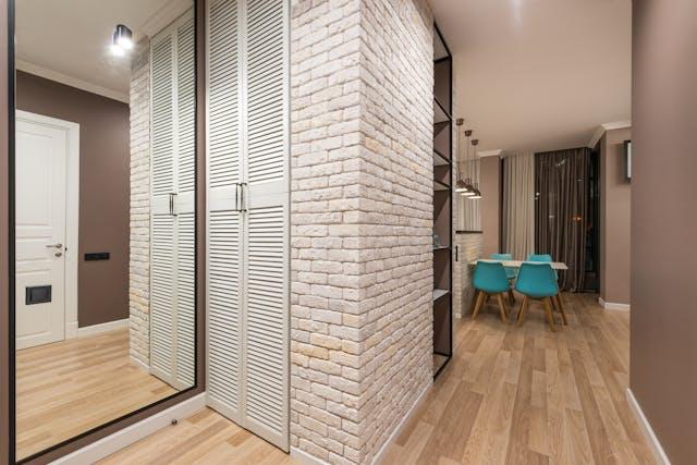 big mirror in the corner of an apartment.