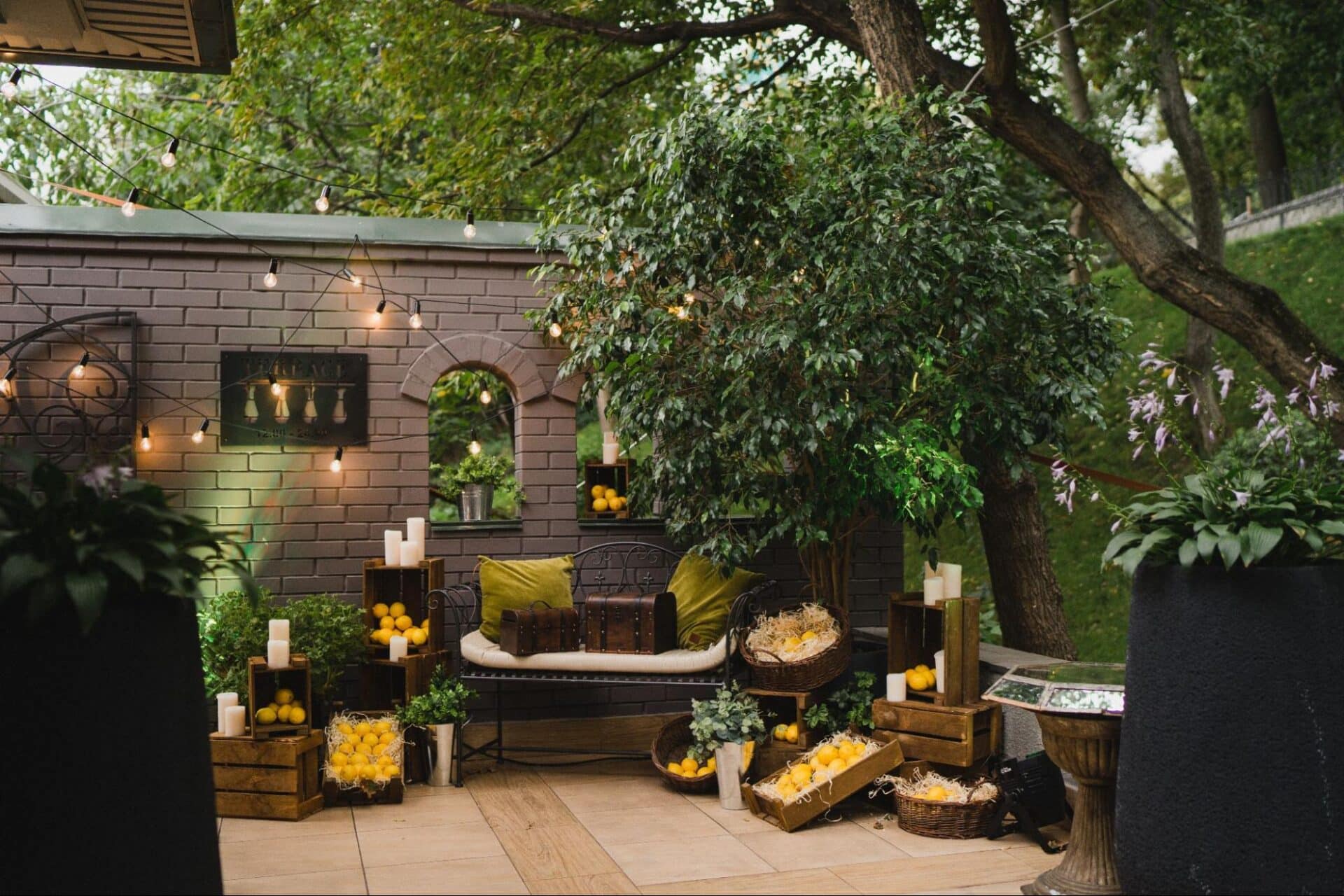 If you’re wondering how to decorate a garden without breaking the bank or losing your mind, you’re in the right place. A well-designed outdoor space can transform your entire home; giving you a place to relax, entertain, and enjoy the seasons. Whether you’ve got a sprawling lawn, a compact patio, or a narrow garden wall, the right garden decor can turn it into your ideal outdoor living room. The good news? You don’t need a landscape architect or a massive budget to make it work. From clever lighting and stylish garden furniture to playful touches like lawn games or a garden pizza oven, it’s all about making the most of your available space and adding personal flair. This guide walks you through the most practical and creative decor ideas, helping you plan, style, and decorate your garden so it’s both beautiful and useful. Ready to give your outdoor area a new lease on life? Let’s start with the most important step: planning it right. Start with a Plan Before buying a single watering can or stringing up fairy lights, take a moment to step back and really look at your space. A well-thought-out layout sets the tone for everything else and saves you time and money in the long run. Start by identifying what you want from your garden. Do you want an outdoor dining area for long summer evenings? A peaceful nook for reading? A play zone for the kids? Create zones that match your lifestyle — even in a small garden, this helps give each part of the outdoor space a clear purpose. Sketch a rough map of the garden. Mark out permanent features like trees, sheds, paths, and any existing garden fence or walls. Then, identify a focal point. This could be something bold like a garden pizza oven, a water feature, or a statement bench surrounded by potted plants. From there, layer in elements that draw attention to it; think climbing plants, raised beds, or a backdrop of evergreen foliage for all-season visual interest. Use natural materials like timber, stone, or gravel to connect the different areas and maintain a cohesive garden feel. And always think in varying heights: tall trees, medium-height planters, and low-growing flowers add depth and make the outdoor area feel more dynamic. Once your layout is clear, the fun part begins: turning those zones into something stylish and functional. Define an Outdoor Living Room Think of your garden as an extension of your home. Creating an outdoor living room makes it more inviting and functional, especially in the warmer months. It's where you can unwind, host friends, or even work with a coffee in hand and the surrounding greenery for company. Start with seating. Choose garden furniture that suits your space: a corner sofa, a couple of weatherproof chairs, or even a hammock can work. Stick to materials made for outdoor use, like rattan, teak, or powder-coated metal. To soften the look, layer on cushions, throws, and an outdoor rug to define the outdoor seating area and make it feel like a proper room. Add a coffee table or side tables for drinks, books, or even potted succulents. Surround the area with potted plants, low planters, or a trellis of climbing plants for a cosy, enclosed feel. Use a garden wall or garden fence as a backdrop and give it a fresh coat of paint. A neutral tone works well, but don’t shy away from bold colour if you want to make a statement. Lighting is key here. String fairy lights overhead, place lanterns at different heights, or add solar-powered stake lights around the perimeter. If you're working with a small garden, mirrors, and wall art can help bounce light and create the illusion of more space. This zone should feel effortless — think laid-back comfort with a bit of personality. A few well-placed garden ornaments, a woven basket for throws, and a set of watering cans styled like decor can really tie it all together. alt=”traditional outdoor wood-fired pizza oven” Create a Garden Dining Area Nothing says summer like outdoor dining. Whether you're hosting weekend brunches or casual pizzas under the stars, a dedicated dining area in your garden is a smart, stylish addition. Start with the essentials: a good outdoor table and sturdy chairs. Choose a set that matches your lifestyle: something compact for a small garden, or a long rustic table if you’ve got the space. Materials matter here too: stone, metal, or hardwoods like teak can handle weather and wear while offering a clean, timeless look. To define the zone, place your dining set on a paved patio, gravel base, or even a rug made for outdoor use. Consider adding a pergola, sail shade, or even repurposed tree branches overhead for a mix of form and function. This also gives you a spot to hang fairy lights, paper lanterns, or vintage bulbs for that perfect evening glow. Surround the space with planters, potted plants, or low raised beds filled with herbs and flowers. Incorporate climbing plants to add height and frame the scene. One great idea: place your garden pizza oven nearby, so food can move seamlessly from oven to table. It makes for an unforgettable experience and serves as a natural focal point. You'll find everything you need for setting up an outdoor pizza oven (even a DIY one) at Vitcas Shop. Want to elevate the decor? Add a table runner, outdoor-safe crockery, and a few seasonal centrepieces: think vases of fresh flowers, bowls of citrus, or lanterns for evening meals. Little touches go a long way in making the dining area feel welcoming, stylish, and part of your overall garden decor. Add Personality with Garden Ornaments and Decor Once the main zones are in place, it’s time to inject personality. The right garden ornaments and accessories can transform your outdoor space from plain to full of character, and it doesn’t have to be expensive. Start with objects that make you smile: vintage signs, sculptures, old lanterns, or even a row of painted watering cans. These kinds of pieces give your garden its own story. Use wall art on your garden wall or fence to break up empty vertical space: metal cut-outs, ceramic plaques, or even framed prints designed for outdoor use all work brilliantly. Mirrors can help bounce light and visually expand a small garden. Think about repurposing everyday items. An old stepladder becomes a tiered plant stand, while crates or palettes can be stacked for quirky shelving. Try hanging picture frames around trailing plants for a playful gallery-style look. Keep it cohesive. Choose a colour scheme or material (like terracotta, zinc, or reclaimed wood) and repeat it throughout your garden decor for a pulled-together, intentional look. A few standout items placed with purpose create more impact than cluttering the space. Add texture by mixing materials, like metal, glass, wood, ceramic. This brings in visual interest and complements your plants. And don’t forget sound: a wind chime or small bubbling water feature adds an extra layer to your garden feel that’s subtle but effective. alt=”small garden decorations in a flowerbed” Add Potted Plants and Raised Beds If there’s one thing that instantly lifts a garden, it’s potted plants. Whether you’ve got a compact patio or a generous lawn, adding greenery in pots and planters is one of the easiest and most versatile decor ideas. Use a mix of varying heights and pot sizes to avoid a flat look. Combine floor-standing planters with raised shelves, hanging pots, and steps to create a layered effect. Group pots in odd numbers for a more natural layout, and choose materials that suit your style: terracotta for rustic charm, concrete for clean minimalism, or bright glazed pots for a cheerful burst of colour. Include a mix of evergreen foliage, flowering plants, and herbs. This ensures year-round appeal and brings scent, texture, and colour to your outdoor area. Climbing plants like jasmine or clematis can be trained up trellises or garden walls, adding vertical interest and softening hard lines. If you’ve got room, build or buy raised beds. These are ideal for creating structure and defining walkways or zones. Fill them with seasonal flowers, vegetables, or pollinator-friendly plants to support wildlife. Use containers to frame key areas like your outdoor seating area or dining area, creating boundaries without walls. And for those with a small garden, hanging planters and wall-mounted pots are a great idea to keep things off the ground but still lush. These flexible, budget-friendly solutions make it easy to swap things out with the seasons, giving your garden a new lease on life throughout the year. Lighting for Ambience and Function Lighting can completely transform your garden, taking it from a plain outdoor area to a warm, inviting haven once the sun goes down. It also makes your garden safer and more usable at night, whether you’re hosting guests or just enjoying a quiet cup of tea. Start with the basics: illuminate paths and steps using stake lights or low-level LED strips. This helps with safety and highlights the flow of your space. Then, layer in ambient lighting. Fairy lights are a go-to choice — drape them across fences, string them through tree branches, or hang them above your dining area or outdoor seating area for an instant mood boost. Lanterns (solar or battery-powered) add a soft, flickering glow and can be moved around easily. Wall-mounted lights or sconces along your garden wall help define vertical space and can double as wall art if chosen well. If you want a bit more drama, use spotlights to highlight a focal point: maybe a sculptural tree, a water feature, or an eye-catching piece of garden decor. Keep the colour temperature warm for a cosy, relaxing atmosphere. Lighting is about more than just visibility; it adds emotion, depth, and function to your garden feel. Paint and Refresh Existing Features Not everything has to be built from scratch, sometimes the best decor ideas involve simply refreshing what you’ve already got. A fresh coat of paint on a tired garden fence, shed, or bench can make a world of difference and give the space a more polished, cohesive look. Start with the walls and boundaries. Painting your garden wall or fence in a dark shade (like charcoal or forest green) makes the greenery pop and gives your garden a modern edge. Lighter tones, like soft sage or warm neutrals, can make a small garden feel bigger and brighter. Don’t forget furniture and fixtures: metal chairs, watering cans, or planters can be revived with outdoor spray paint. Wooden garden furniture can be sanded and oiled or painted in cheerful colours to add personality. Consider patterns too. Paint stripes or a geometric design on a patio floor, or stencil motifs onto plant boxes or raised beds. It’s a budget-friendly way to bring in some style and creativity without investing in new pieces. Reviving existing elements helps your garden feel cared for and updated, breathing new life into your outdoor space with minimal effort. alt=”ambient garden lighting” Use Vertical Space for Visual Interest When floor space is limited, or even when it’s not, going vertical is a great idea. It draws the eye upward, adds layers of texture, and maximises every bit of your available space. It’s especially useful in a small garden or balcony-style setup. Start by looking at your walls, fences, and even the sides of sheds. Install brackets or shelves to hold potted plants, small sculptures, or lanterns. Mount hanging planters or use vertical pocket planters for herbs, trailing vines, or flowers. This kind of setup doubles as a living wall, which not only looks striking but also improves air quality and supports biodiversity. Climbing plants like honeysuckle, ivy, or clematis can be trained over trellises or arches. You can even frame a seating or dining area with vertical greenery to give it that lush, enclosed feel. Use multi-level plant stands or tall planters to stagger heights and break up flat areas. Hanging baskets filled with cascading blooms are another simple way to add movement and charm. By using vertical space thoughtfully, you bring in visual interest, increase your planting area, and give your garden a layered, professional finish; no matter how much ground you’re working with. Incorporate Lawn Games and Family Fun Decorating your garden isn’t just about looks, it’s about lifestyle. If you have kids, pets, or just love entertaining, building in elements of fun is a great idea. A well-placed area for lawn games can add both function and personality to your outdoor space. Keep part of the lawn clear and level for games like boules, croquet, or giant Jenga. If your space is tight, consider foldaway or multi-use options that can be stored when not in use. Use raised beds or planters to frame the play area, making it feel intentional rather than just leftover turf. Hang a swing from sturdy tree branches, install a hammock between posts, or add a chalkboard to a garden wall for kids’ drawing space. These touches invite interaction and make your garden a true extension of your home. To keep things tidy, go for dual-purpose storage. Benches with built-in compartments or waterproof boxes can house outdoor toys, cushions, or even picnic gear, keeping your garden decor looking clean and organised. Style It Like the Pros (Inspiration + Finishing Touches) Now comes the fun part: bringing it all together with layers of style, comfort, and detail. Pros like Sara Ligorria Tramp and Amy Bartlam nail that effortless, lived-in vibe by combining utility with charm. Here’s how to do the same. Blend your indoor and outdoor worlds. Choose textiles, colours, and decor that echo your interior palette: it creates a fluid transition and makes your garden feel like a real room, not an afterthought. For example, use throws, scatter cushions, and outdoor rugs that match your indoor tones. Add finishing touches: ceramic pots filled with herbs, glass jars turned lanterns, or a small tray of drinks on the outdoor table. Group potted plants near seating, dot garden ornaments along borders, and place picture frames or decorative wall art on fences for added charm. Don’t be afraid to experiment. Try a bold feature wall behind your outdoor seating area, or use mixed materials, woven rattan, painted metal, reclaimed wood, for texture. Little DIY upgrades go a long way and make your garden feel uniquely yours. In the end, it's not about perfection; it’s about creating a space that works for your life and reflects your personality. The right combination of practical design and creative flair can turn even the simplest garden into your favourite outdoor area. Summary Learning how to decorate garden spaces doesn’t require a design degree — just a bit of planning, creativity, and inspiration. From setting up a cosy outdoor living room, to defining a stylish dining area, adding potted plants, or even building your own garden pizza oven, the possibilities are endless. Every element, whether it’s garden furniture, lighting, climbing plants, or clever wall art, adds another layer to your garden’s story. Use what you have, refresh what you can, and don’t shy away from personal touches or DIY details. Even the smallest upgrades can give your garden a new lease on life. So grab your watering cans, pick a spot, and start bringing your vision to life. With the right decor ideas, your outdoor space will be more than just a garden. It’ll be your favourite place to be.