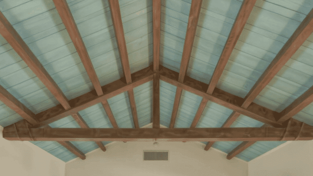 painted beams in a contrasting color vaulted ceiling