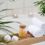 Bathroom with candles and tropical plants