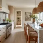 Modern kitchen with marble countertops, wicker pendant lights, and wooden bar stools
